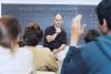 Male Teacher Asking Students Questions During Seminar