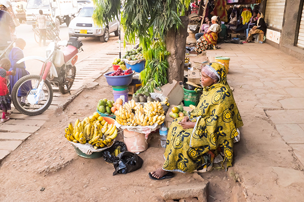 African young woman sells fuits on the street market [nid:47904]