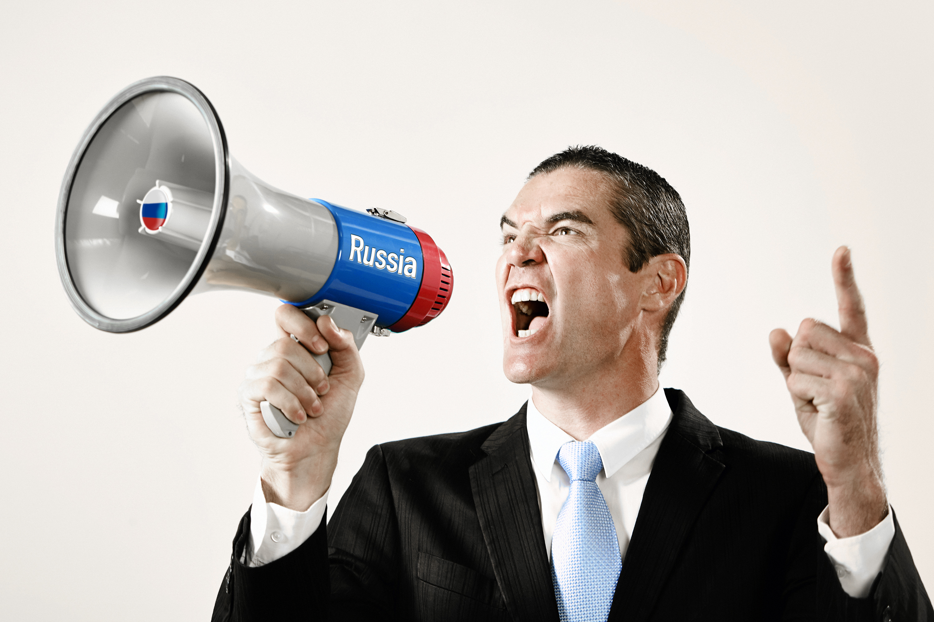 Well-dressed man shouts into a Russian loudhailer