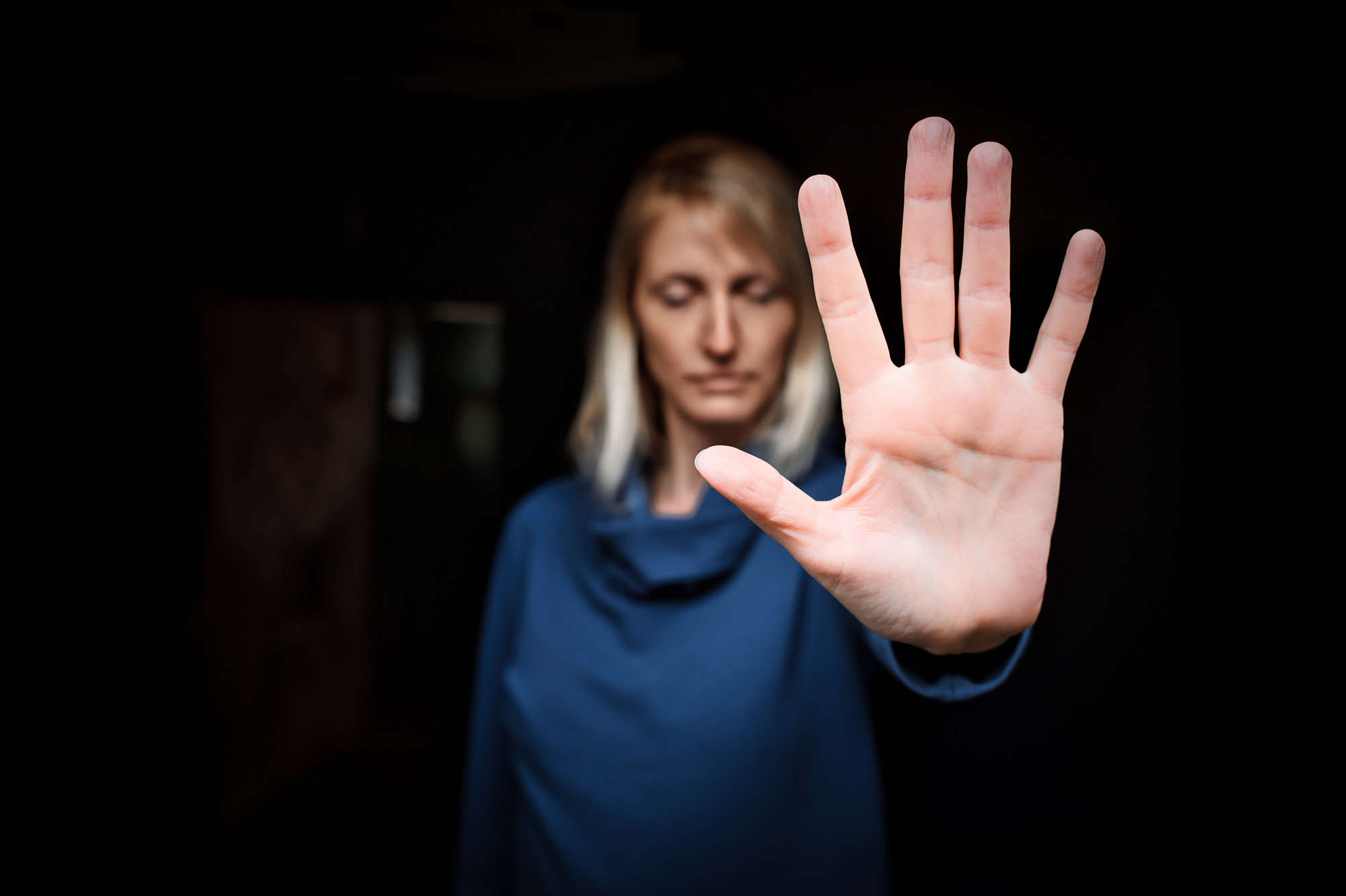 Close-up of a young woman making a stop gesture