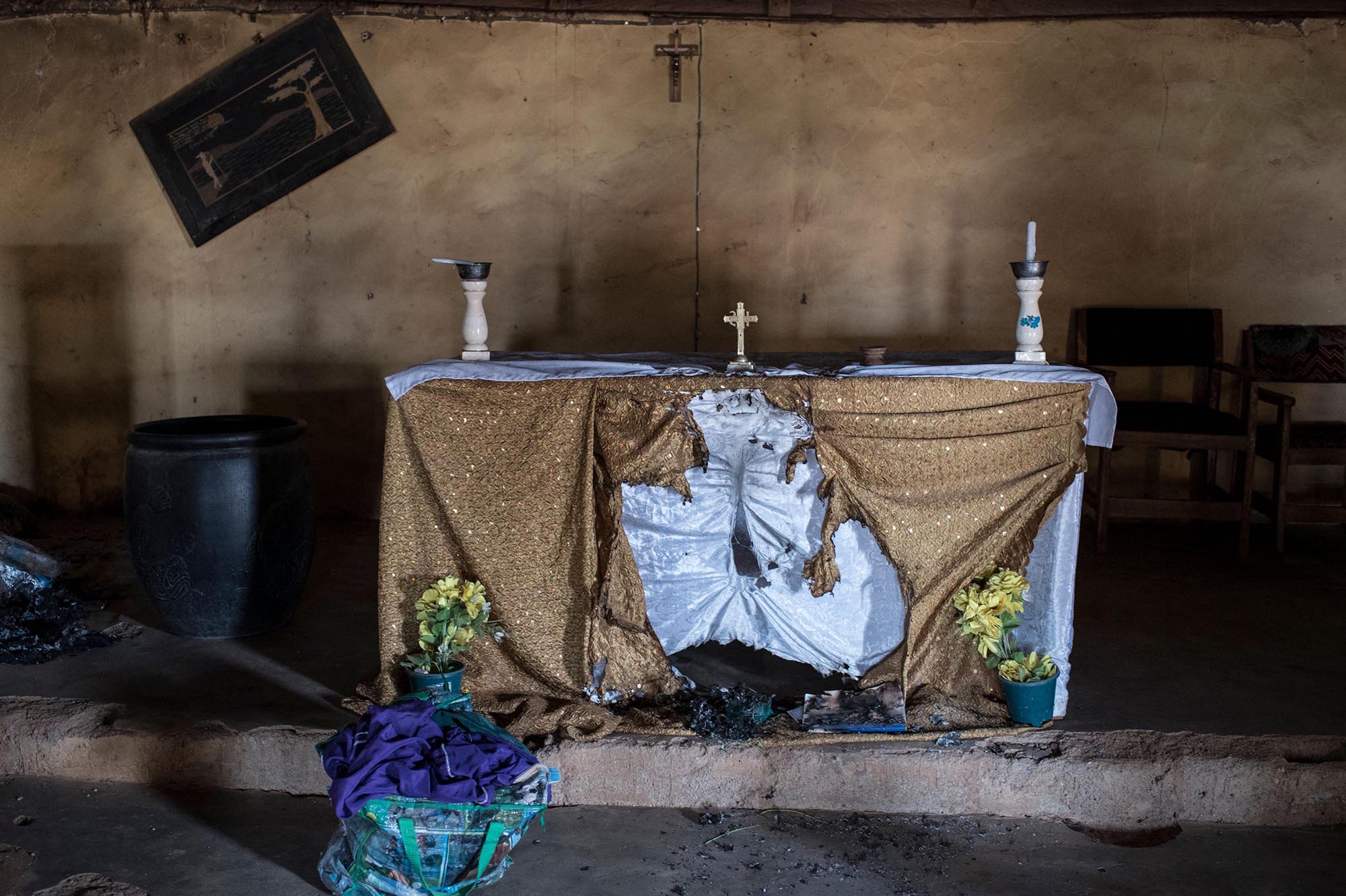 A picture taken on February 24, 2017 shows the damaged alter of Saint Moses Catholic Church in the village of Bakin Kogi, in Kaduna state, northwest Nigeria, that was recently attacked by suspected Fulani herdsmen