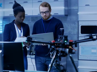 a couple trying to fly a drone