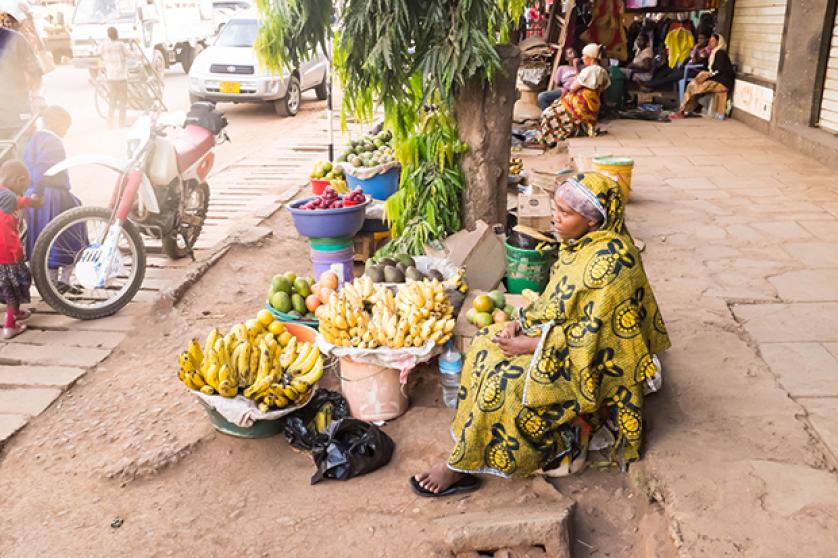African young woman sells fuits on the street market (47904)