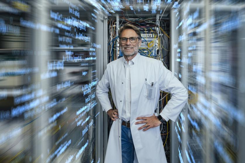 An engineer infront of a supercomputer