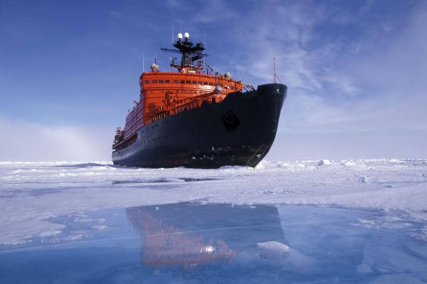 A RUSSIAN ICEBREAKER AT THE NORTH POLE REFLECTION IN MELT WATER POOL