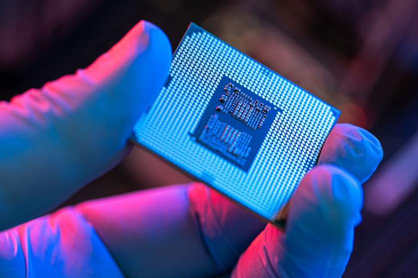 A hand holding a chip (semiconductor) 