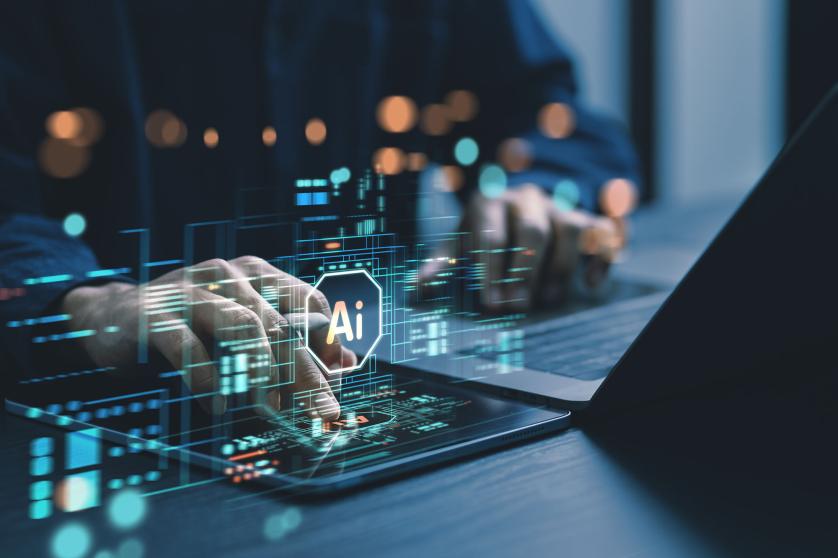 Humans are using laptops and computers to interact with AI