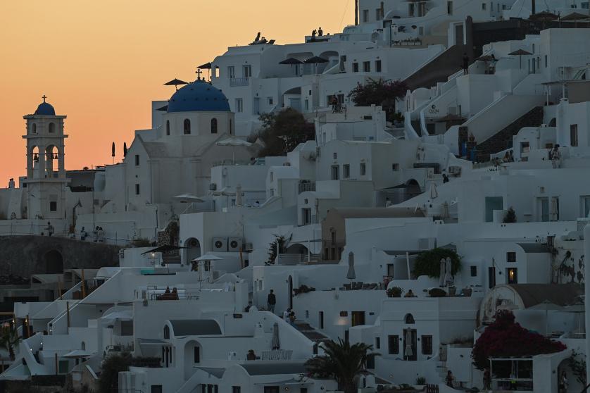 A sunset view of the village of Imerovigli in Santorini, Greece