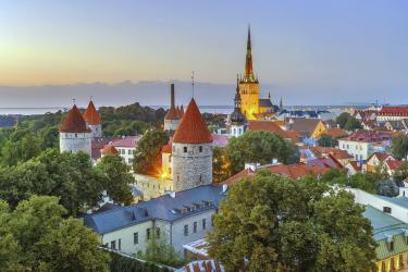 View of Walls of Tallinn and St. Olaf Church from Toompea hill in evening, Estonia