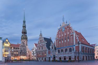 View of the town hall square with the House of the Blackheads and of St Peters Church in Riga, Latvia