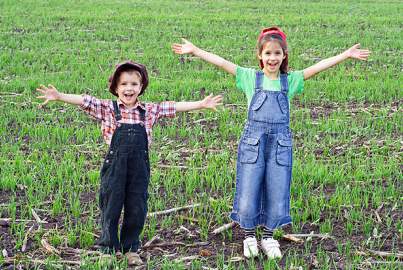 Two happy kids in the field