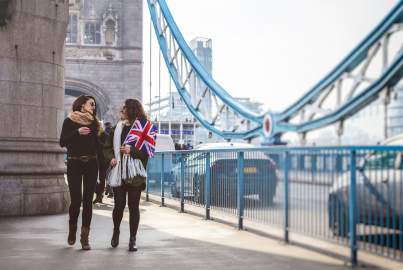 two ladies walking in the London bridge