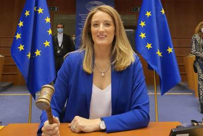 Roberta Metsola presiding over a plenary session for the European Parliament and holding a gavel.
