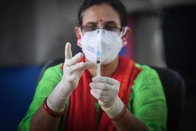 A health worker seen preparing the 2nd jab of Covaxin vaccine