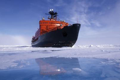 A RUSSIAN ICEBREAKER AT THE NORTH POLE REFLECTION IN MELT WATER POOL