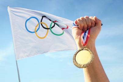 olympic flag and a gold medal