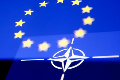 Flags of European Union and NATO displayed on phone screens