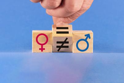 A hand changes an unequal sign to an equal sign between male and female symbols