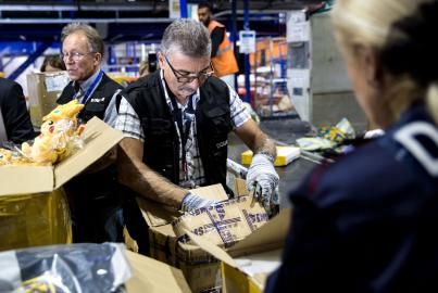 Customs agents are on duty during a visit of French Secretary of State for the Budget and Public Accounts