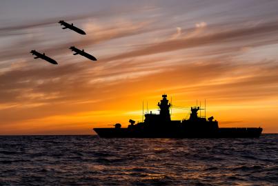 Cruise missiles and warship at sea